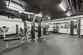 a fitness room with weights and other exercise equipment at Rialto, Washington